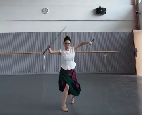 Tai girl performing Sword Martial Arts